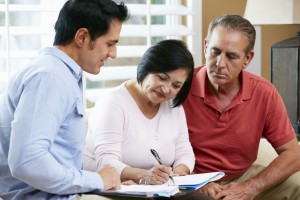 Financial Advisor Talking To Senior Couple