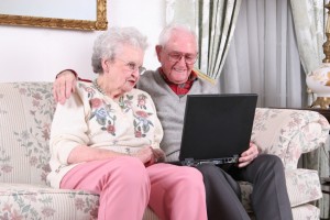 2 elderly people on the couch